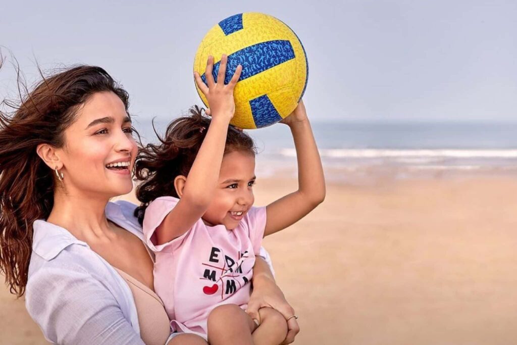 Alia Bhatt on Beach playing with a kid